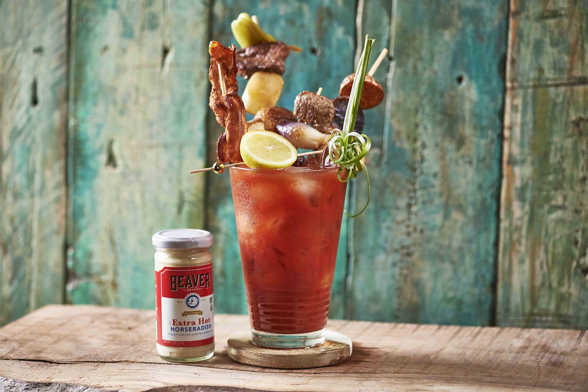 beaver-brand-extra-hot-bloody-mary_slider Iced bloody mary topped with lemon, bacon, steak, and onions, plus Beaver Brand Extra Hot Horseradish