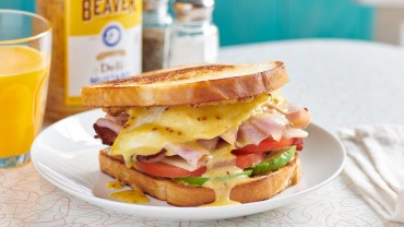 American breakfast sandwich with Beaver Brand Deli Mustard hollandaise sauce