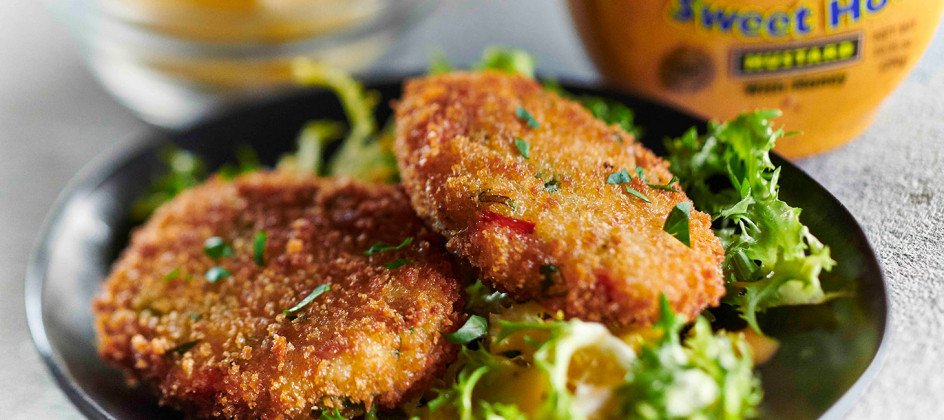 Crab cakes over salad with Inglehoffer Sweet Hot Mustard